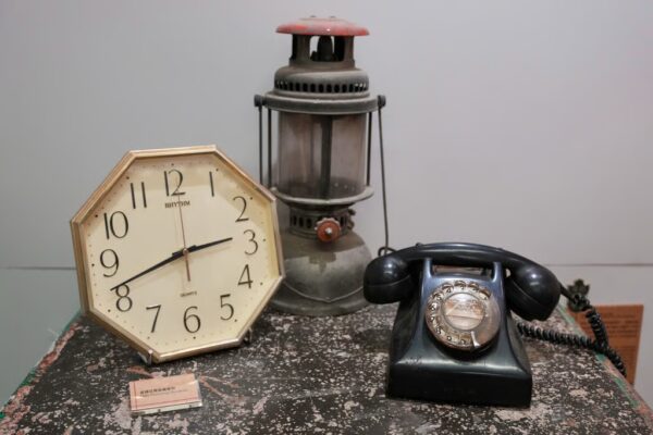 Vintage memorabilia – a clock, lantern and rotary telephone – is on display. Photo: Karma Lo