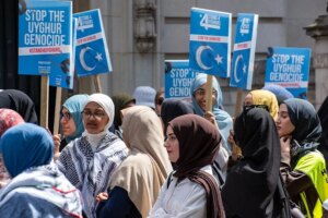 Protesters demonstrate outside the Chinese Embassy in London to protest the systematic oppression of Muslim minorities in Xinjiang, demanding that Beijing dismantle its internment camps and respect basic religious freedom. Fueling the rally was a growing global call to boycott the fast-fashion e-commerce platform Temu, which international investigators and legal complaints accuse of dodging forced-labor trade laws to profit from products heavily linked to state-sponsored Uyghur slave labor.