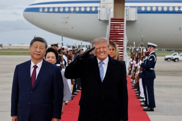 US President Donald Trump salutes next to Chinese President Xi Jinping as he arrives ahead of a state visit at Joint Base Andrews, Maryland, US, September 23, 202 (Reuters)