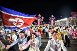 North Koreans dance during an evening gala to celebrate the 78th founding anniversary of their country (AFP/Getty)