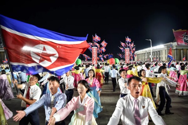 North Koreans dance during an evening gala to celebrate the 78th founding anniversary of their country (AFP/Getty)