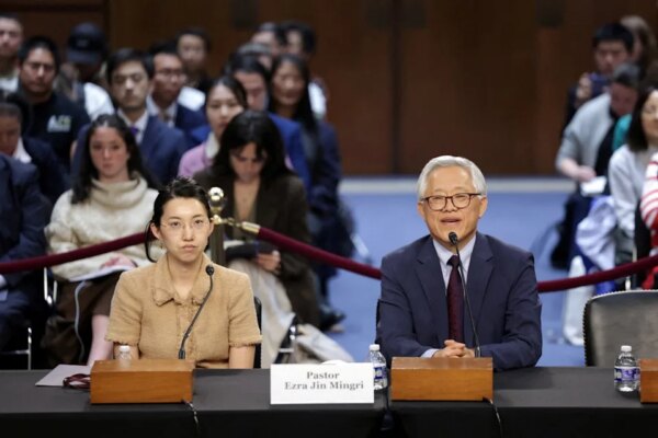 Pastor Ezra Jin Mingri with his daughter Grace (Reuters)