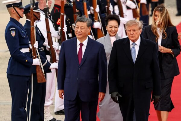 Kevin Lamarque/Reuters - PHOTO: President Donald Trump and first lady Melania Trump walk with China's President Xi Jinping and his wife Peng Liyuan upon their arrival at Joint Base Andrews, Md., Sept. 23, 2026.
