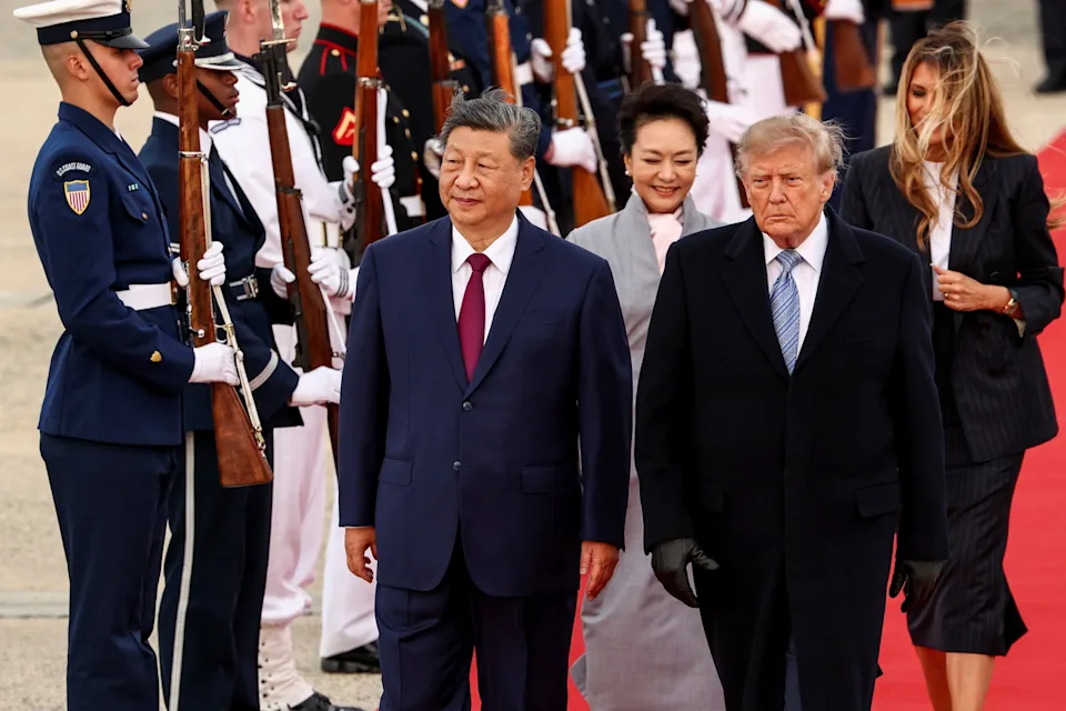 Kevin Lamarque/Reuters - PHOTO: President Donald Trump and first lady Melania Trump walk with China's President Xi Jinping and his wife Peng Liyuan upon their arrival at Joint Base Andrews, Md., Sept. 23, 2026.