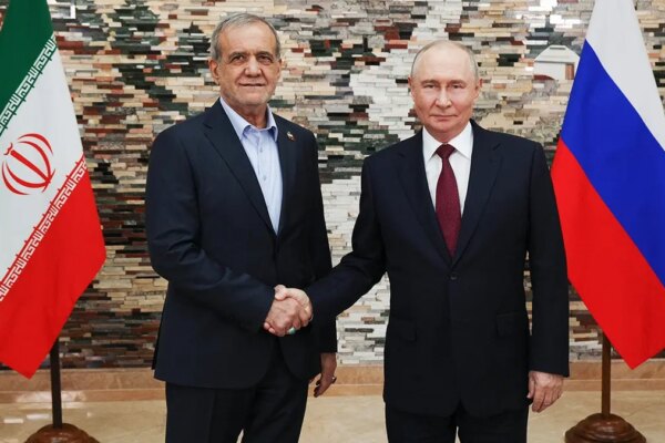 Vladimir Putin and Masoud Pezeshkian pose for a photo during their meeting in Bishkek.