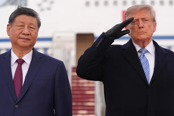 President Donald Trump and Xi Jinping stand together at an arrival ceremony.