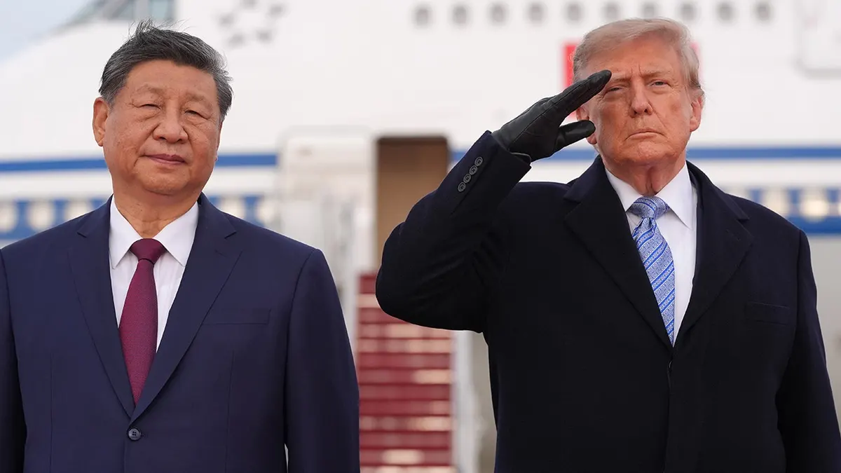 President Donald Trump and Xi Jinping stand together at an arrival ceremony.